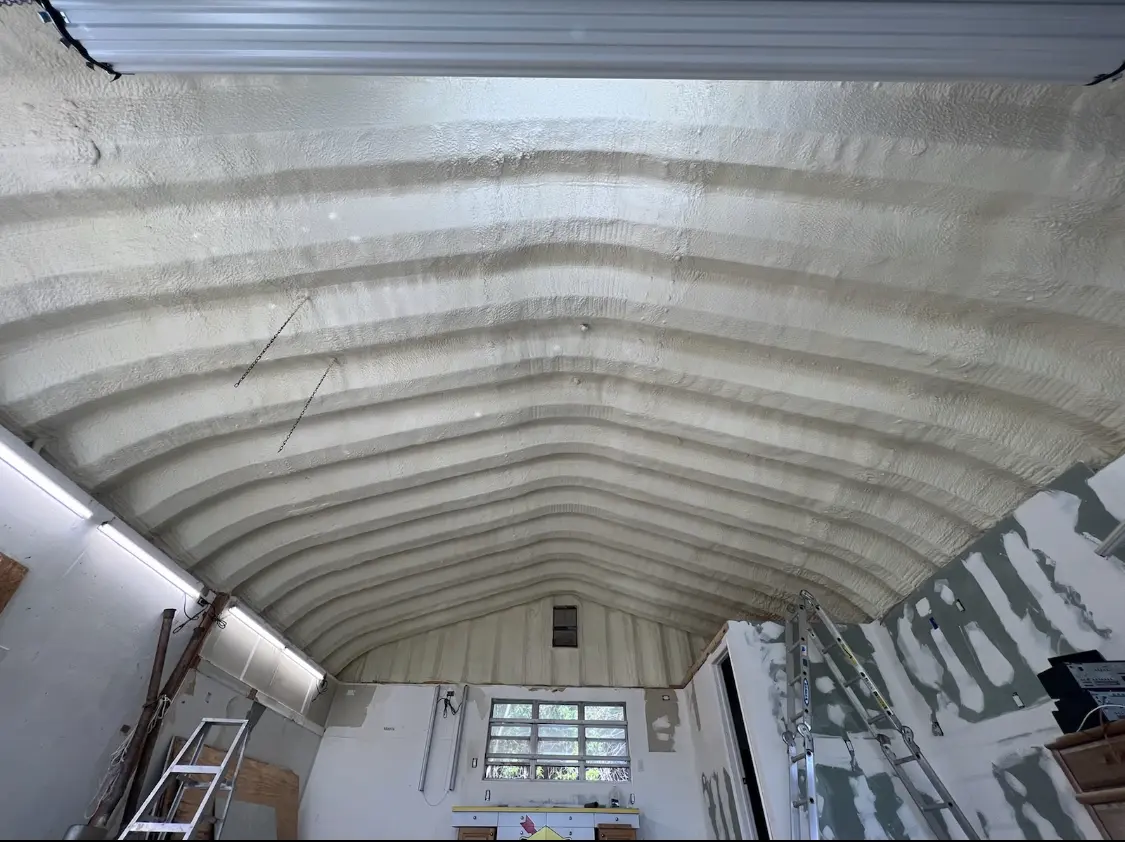 Spray polyurethane foam applied to the underside of a metal roof deck in Belton